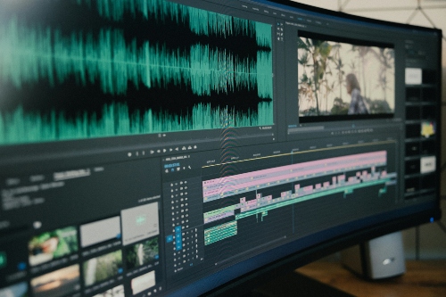 An ultrawide monitor displaying a video editing software in use